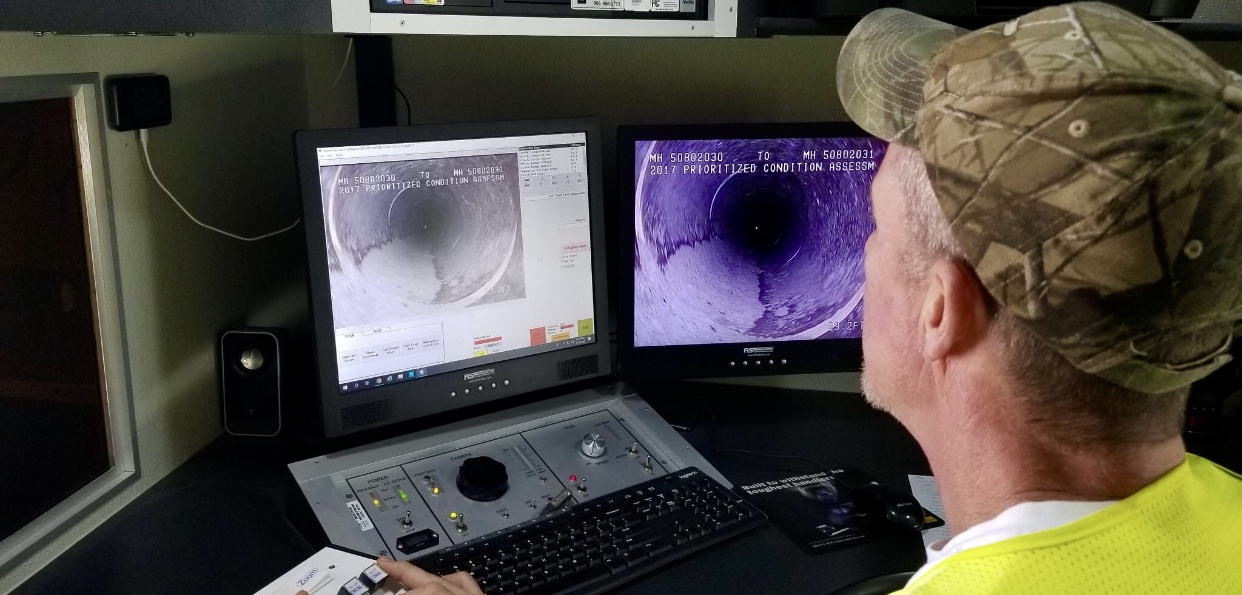 Tele-Vac sewer inspection crew and equipment